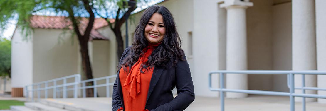 Elizabeth Soto Stands smiling in the courtyard of Downtown Campus